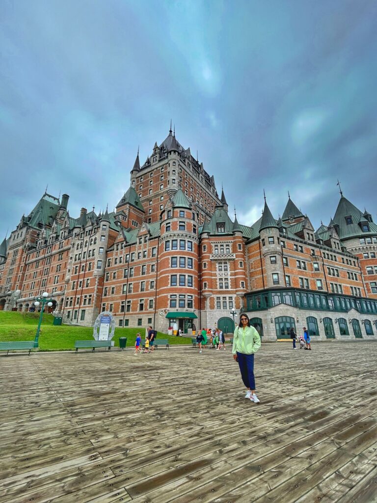 Photo of Canoo member standing in front of a historic building in Quebec City near Montreal.