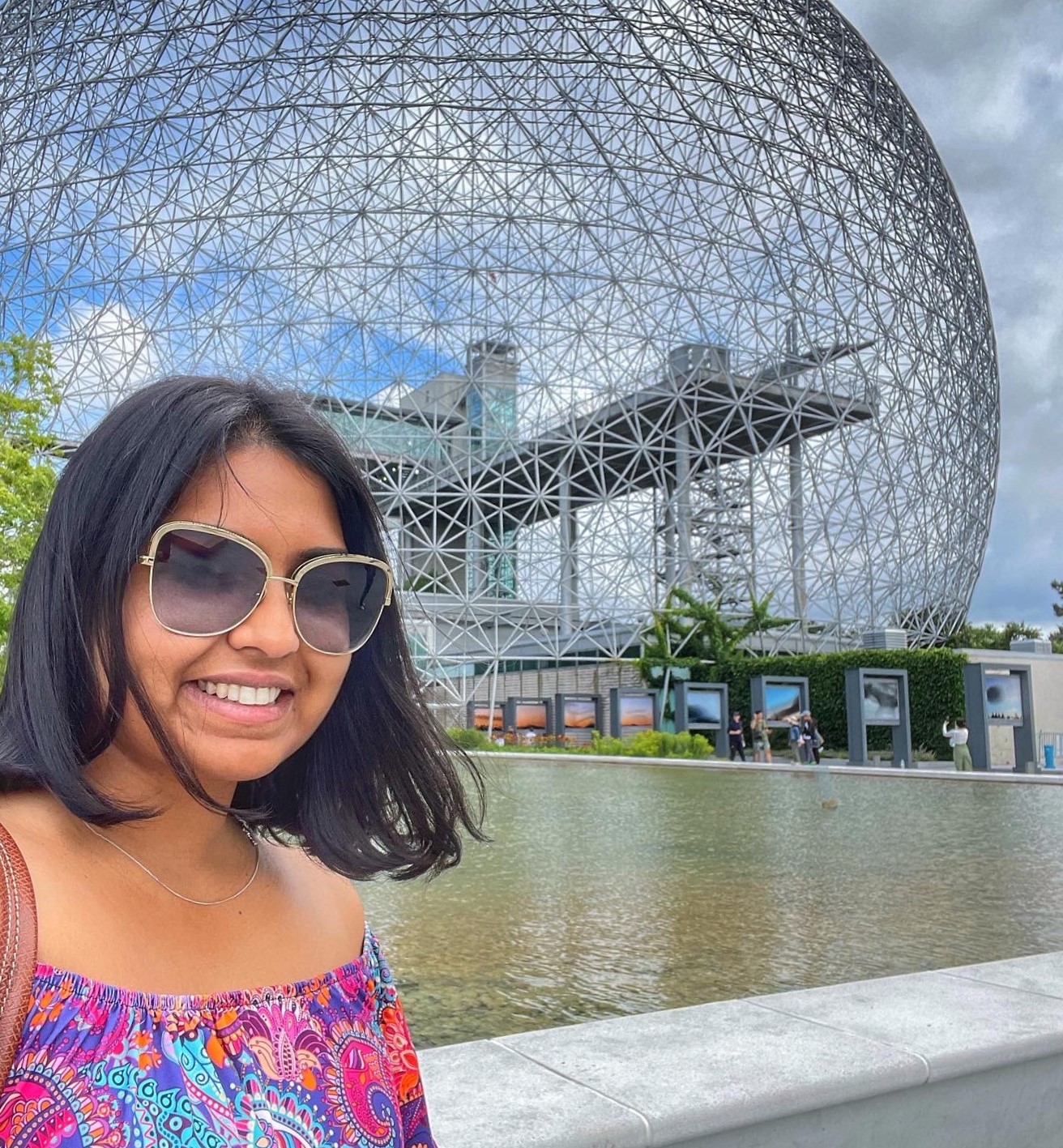 Photo of Canoo member standing in front of the Montreal Biosphere.