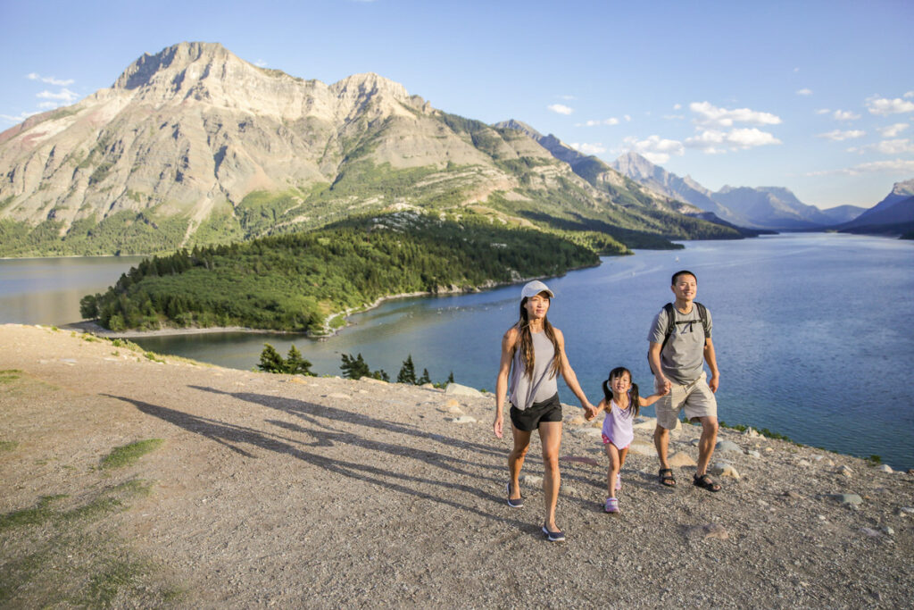 A young family on the Prince of Wales hill, at Waterton Lakes National Park.