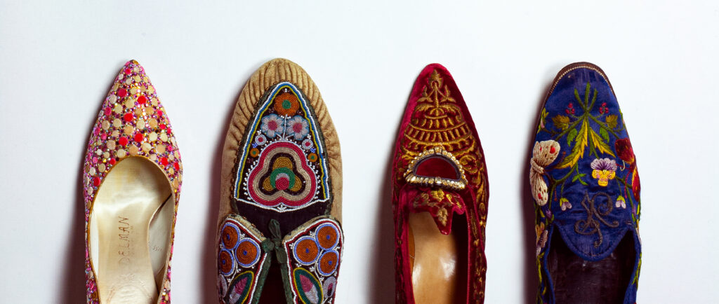 Photo of four shoes on display at the Bata Shoe Museum