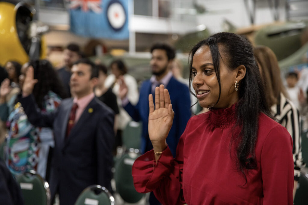 A person taking their oath of citizenship at a Canadian citizenship ceremony.