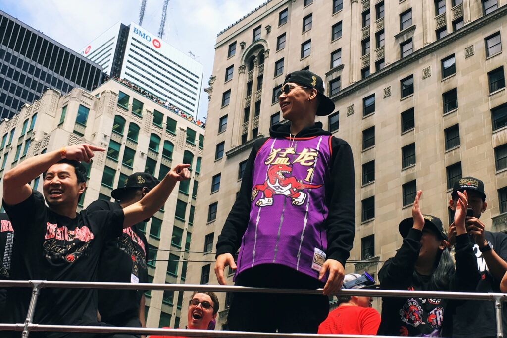 Toronto Raptors fans and players celebrating their 2019 championship win in the NBA Finals.