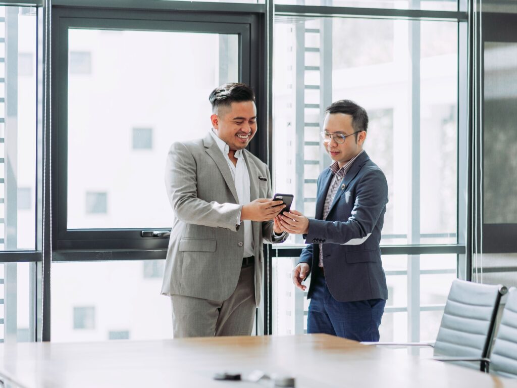 Two people celebrating the success of a business after they completed their product design course.