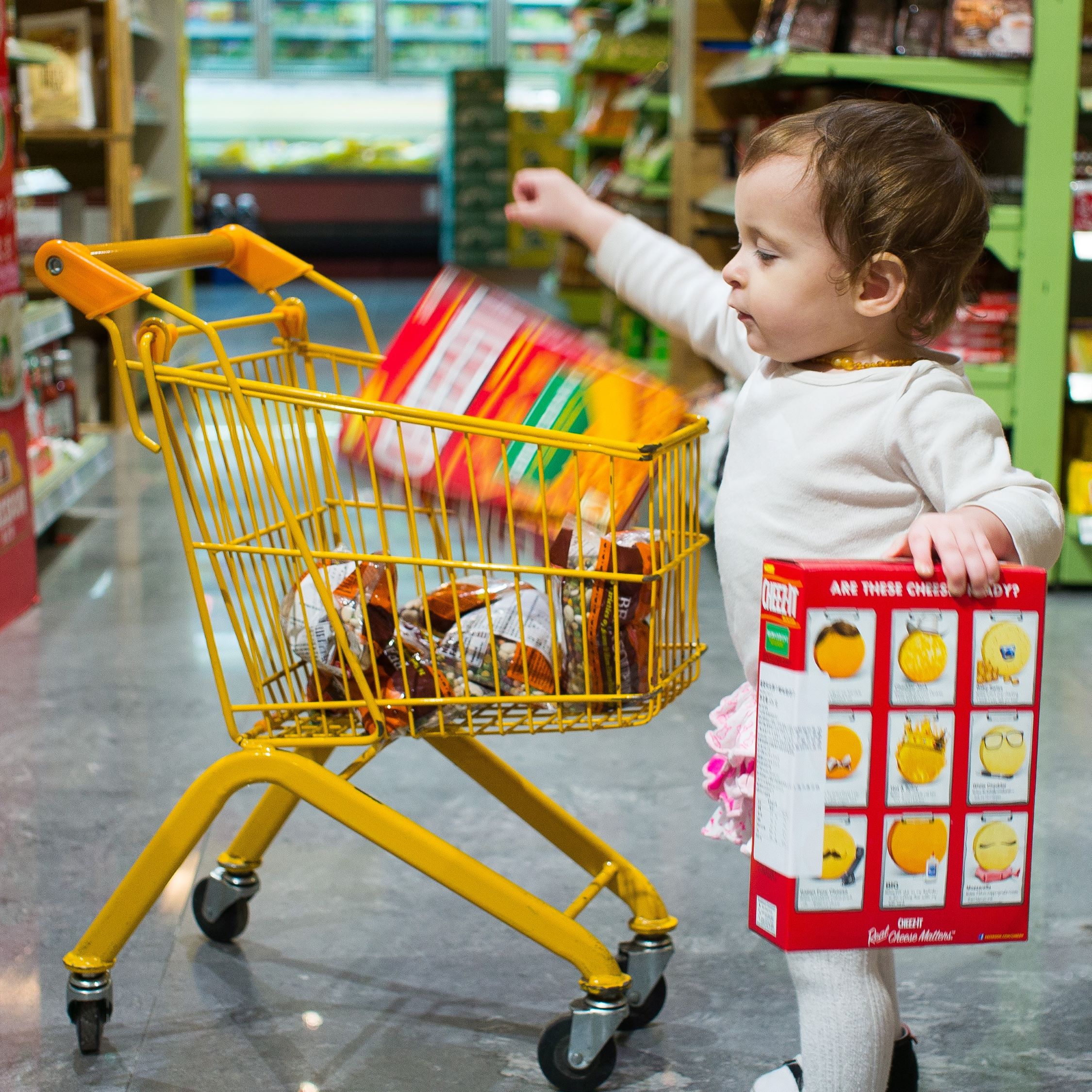 Photo of a child grocery shopping.