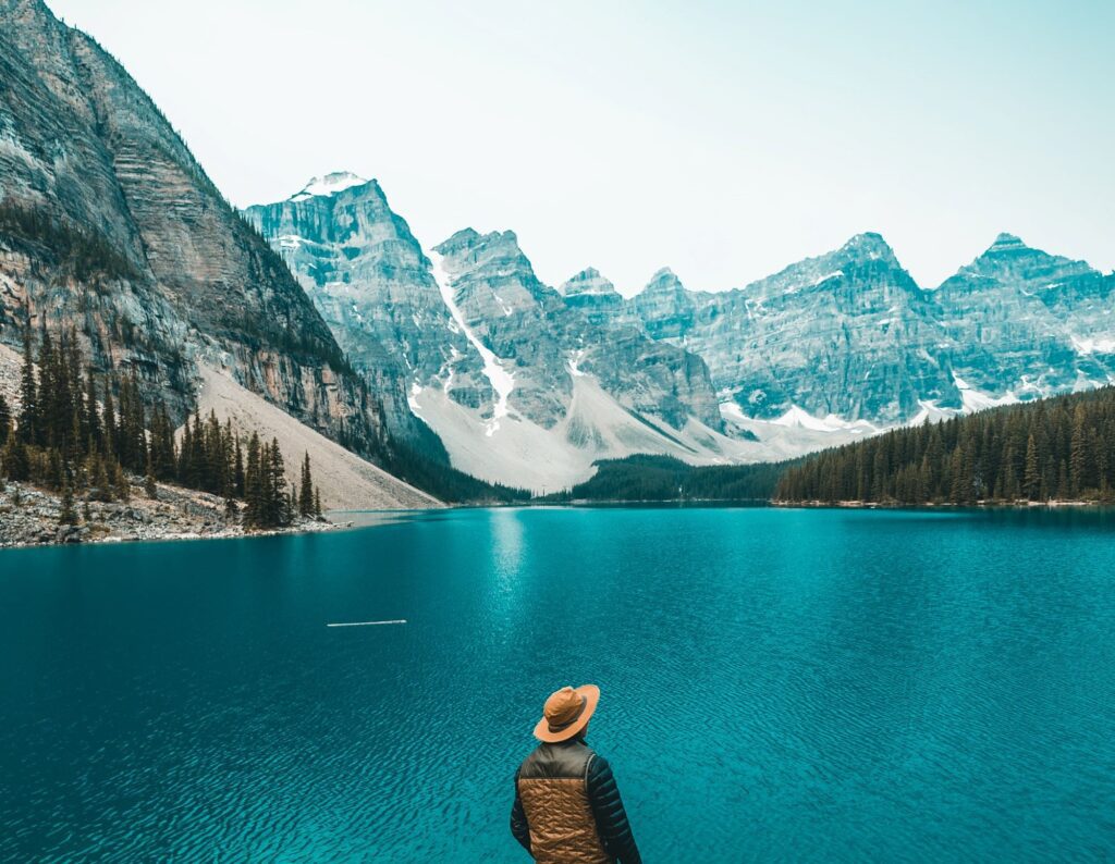 A person standing in front of Lake Louise