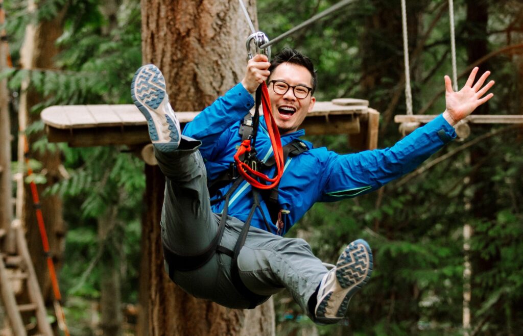 Canoo member ziplining through forests in B.C.