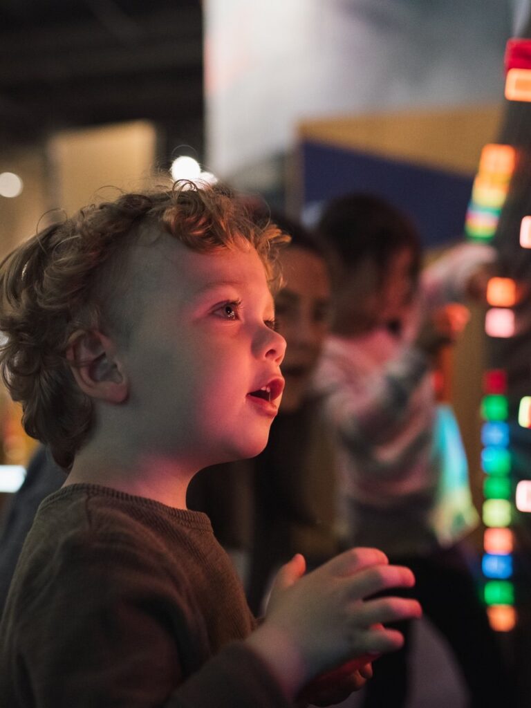 A child looking at an exhibit at Science World.