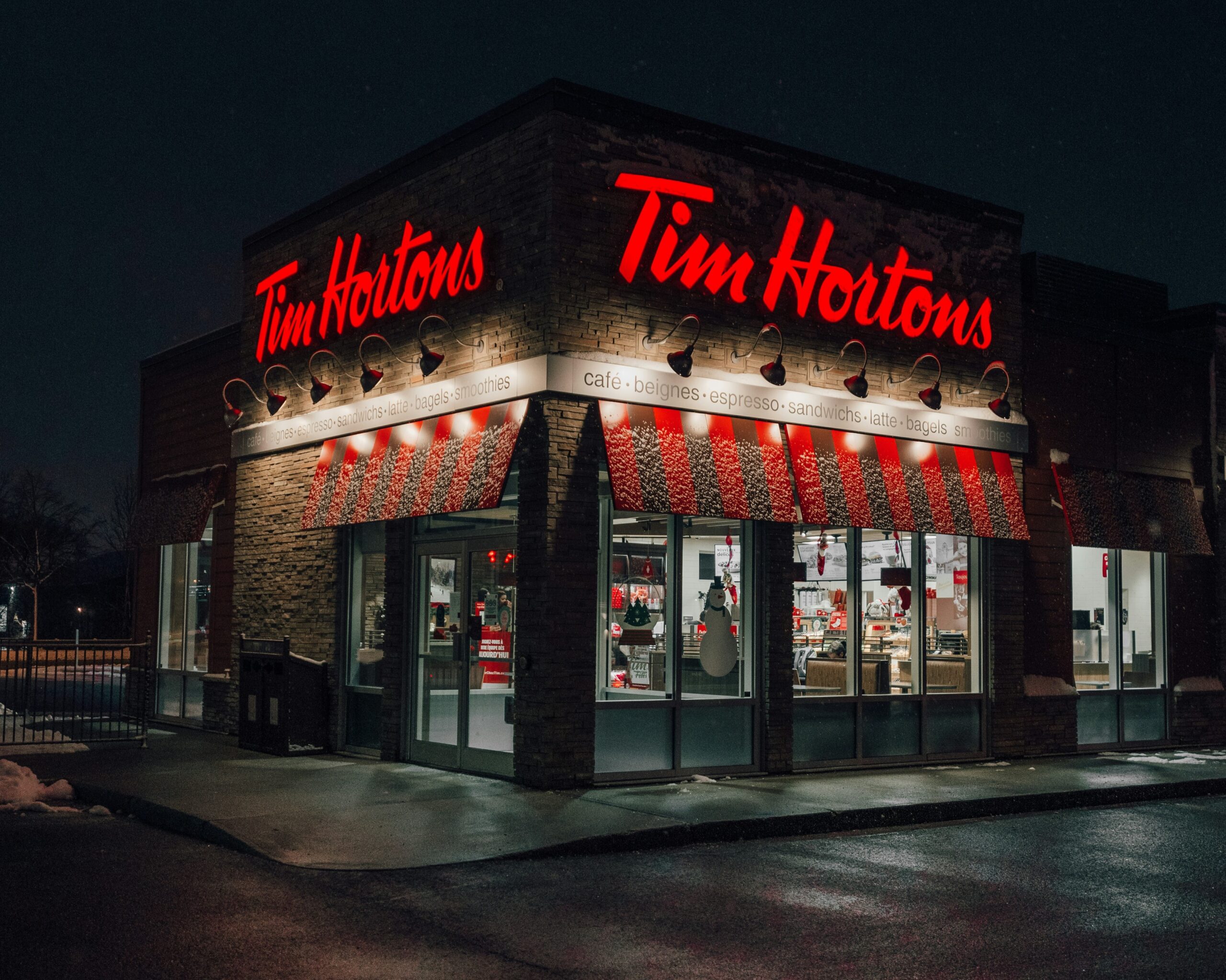 Photo of a Tim Horton's restaurant at night.
