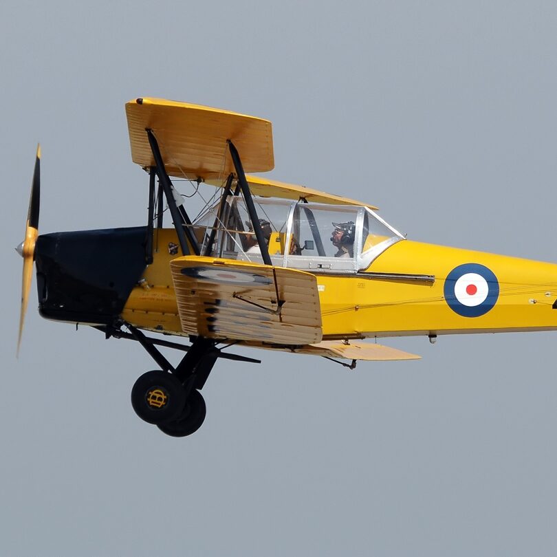 A plane flying in the sky at the Canadian Flight Museum in Vancouver.