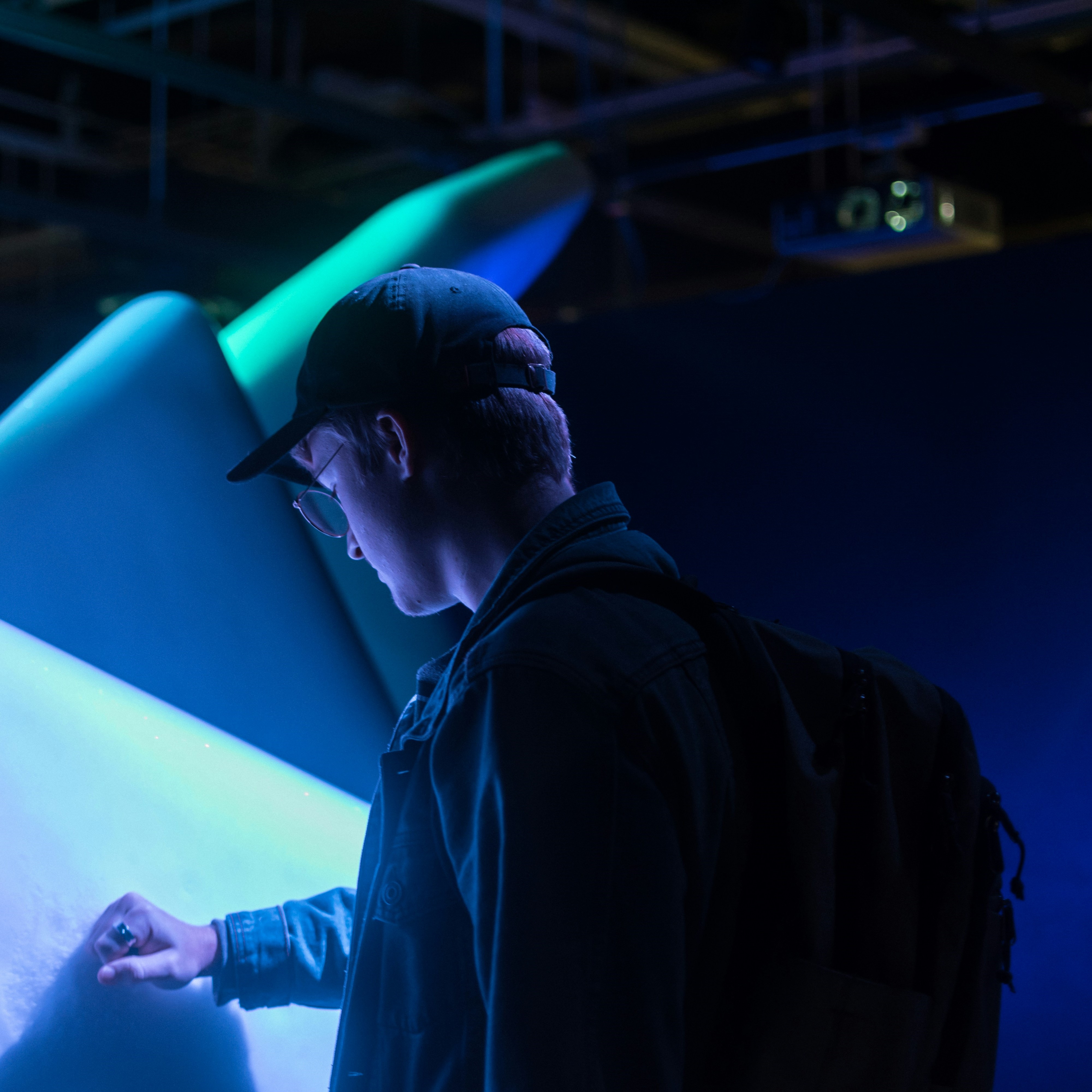 A teenager going through the Canadian Museum of Nature with his family.