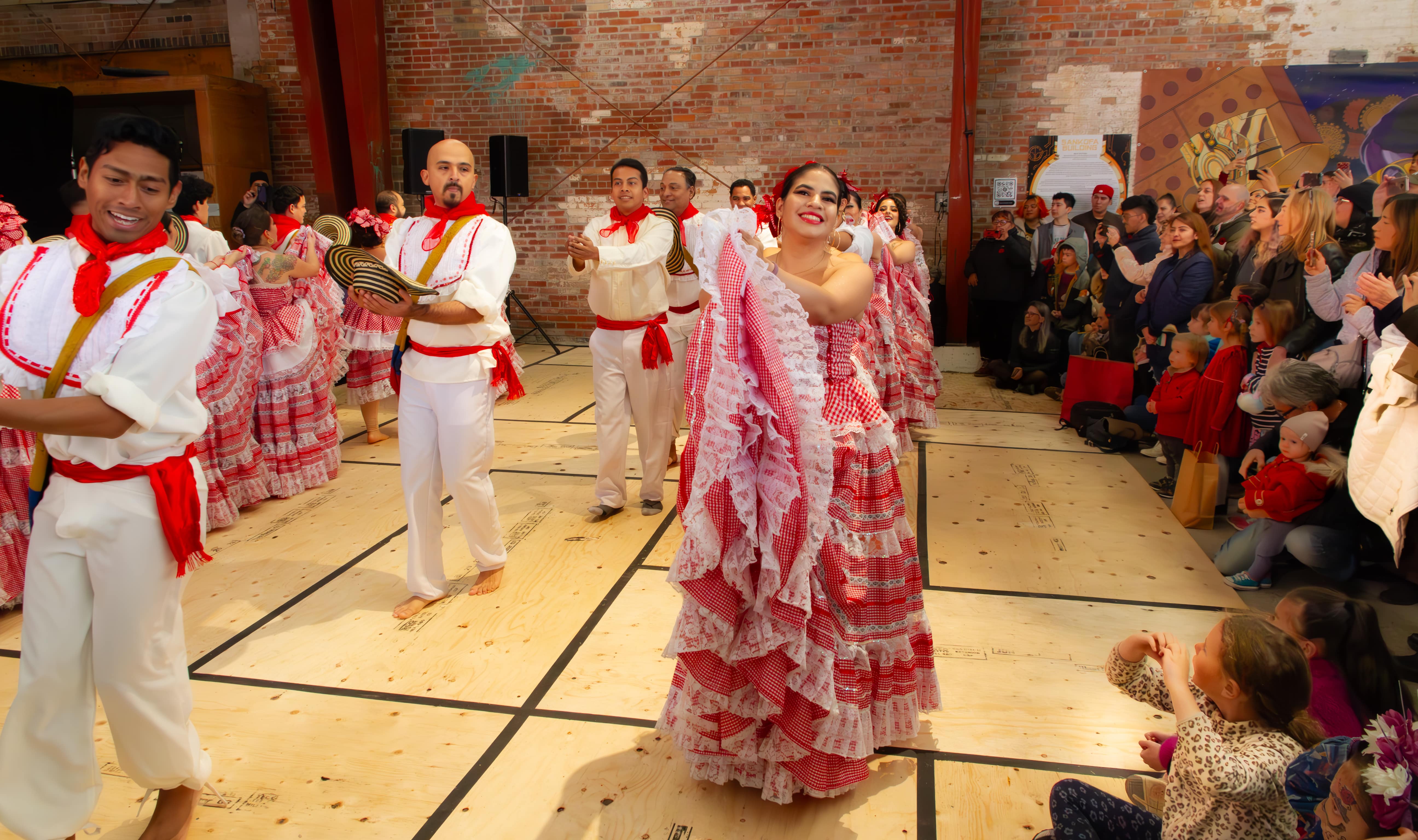 People dancing at the Evergreen Brick Work Day of the Dead Festival.