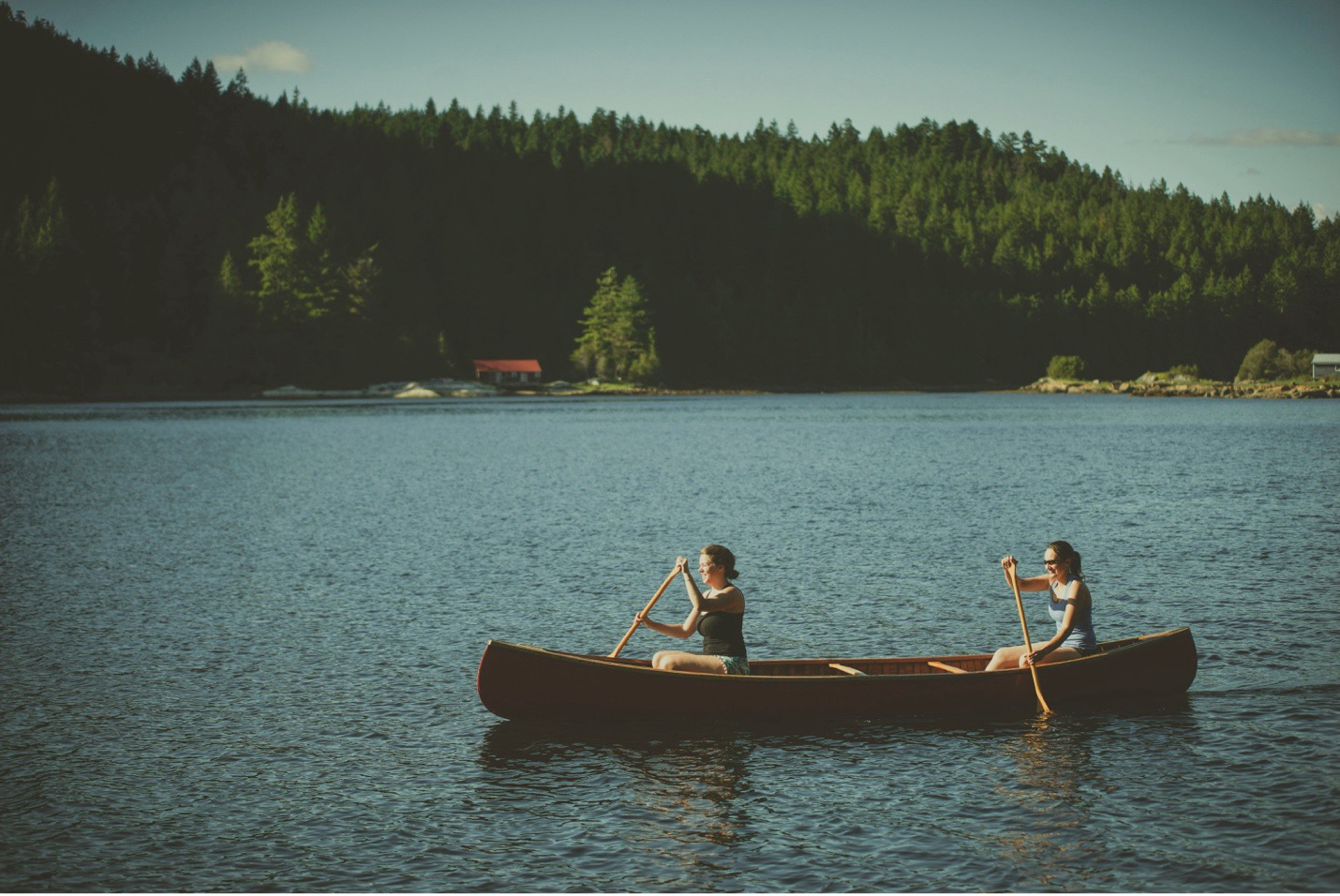 Friends canoeing together on the sunshine coast in BC.