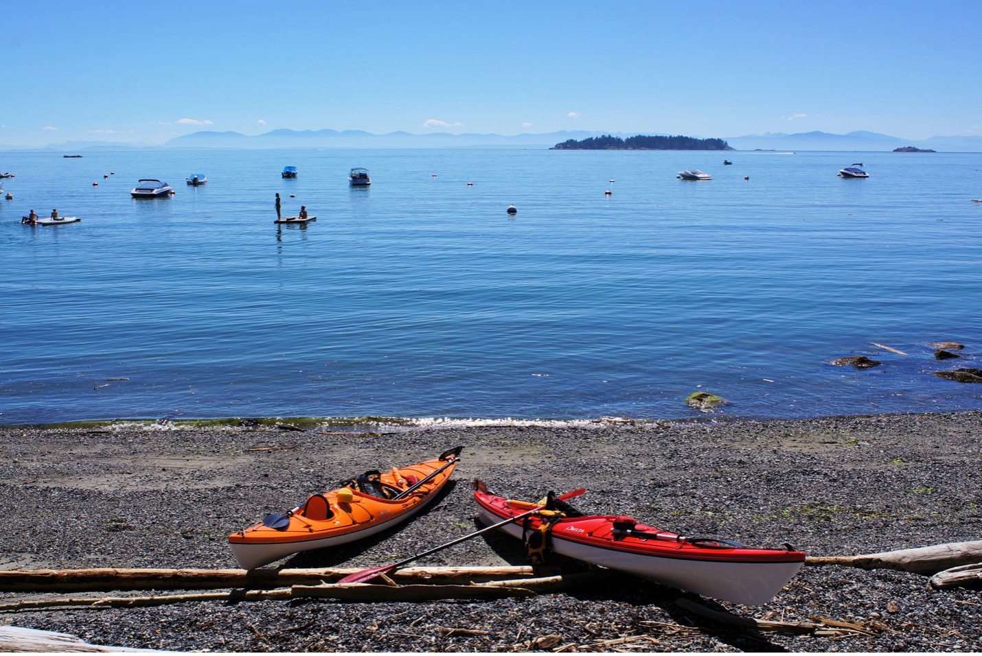 kayaks on a beach on Bowen Island.