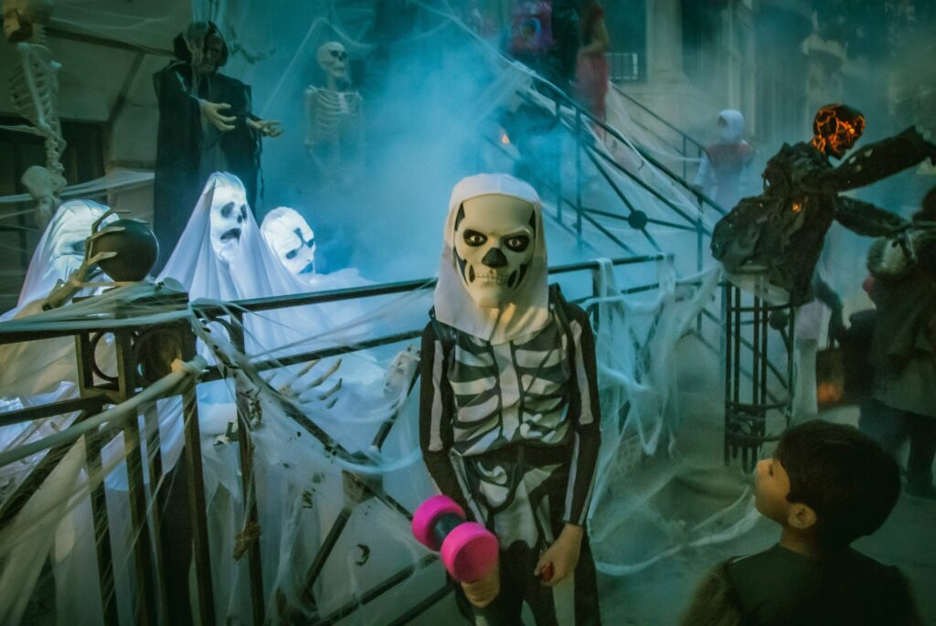 Halloween haunted house with skeletons and spider web decoration 