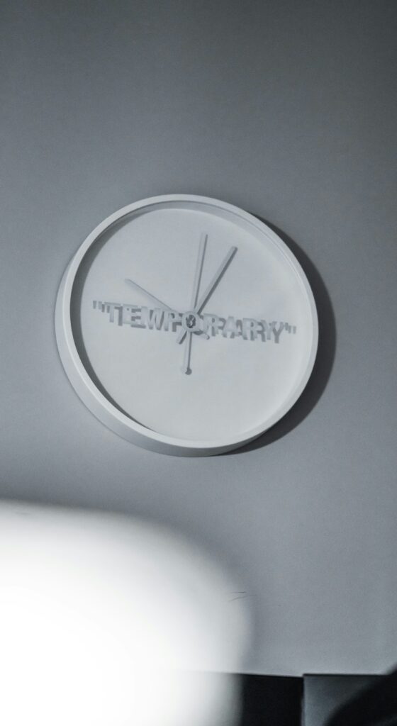 Clock that says temporary on its face 