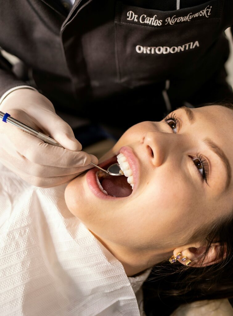 Person visiting their dentist for a check up.