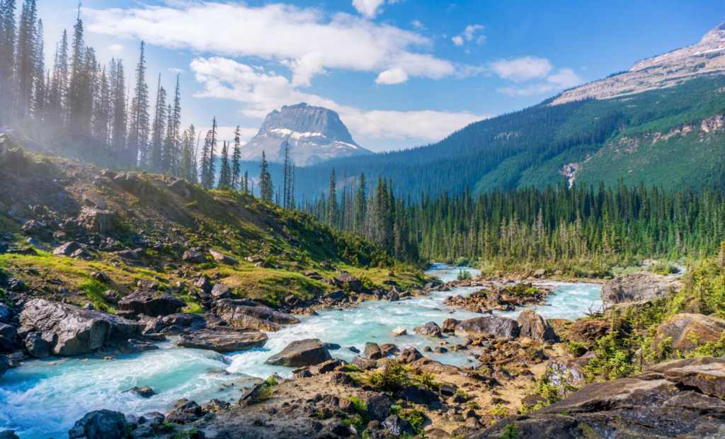 a river with a back drop of mountains