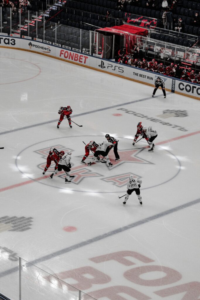 Ice hockey players on ice hockey field playing a game 