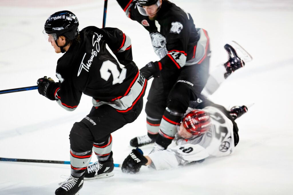 Hockey tactic by men playing Ice Hockey