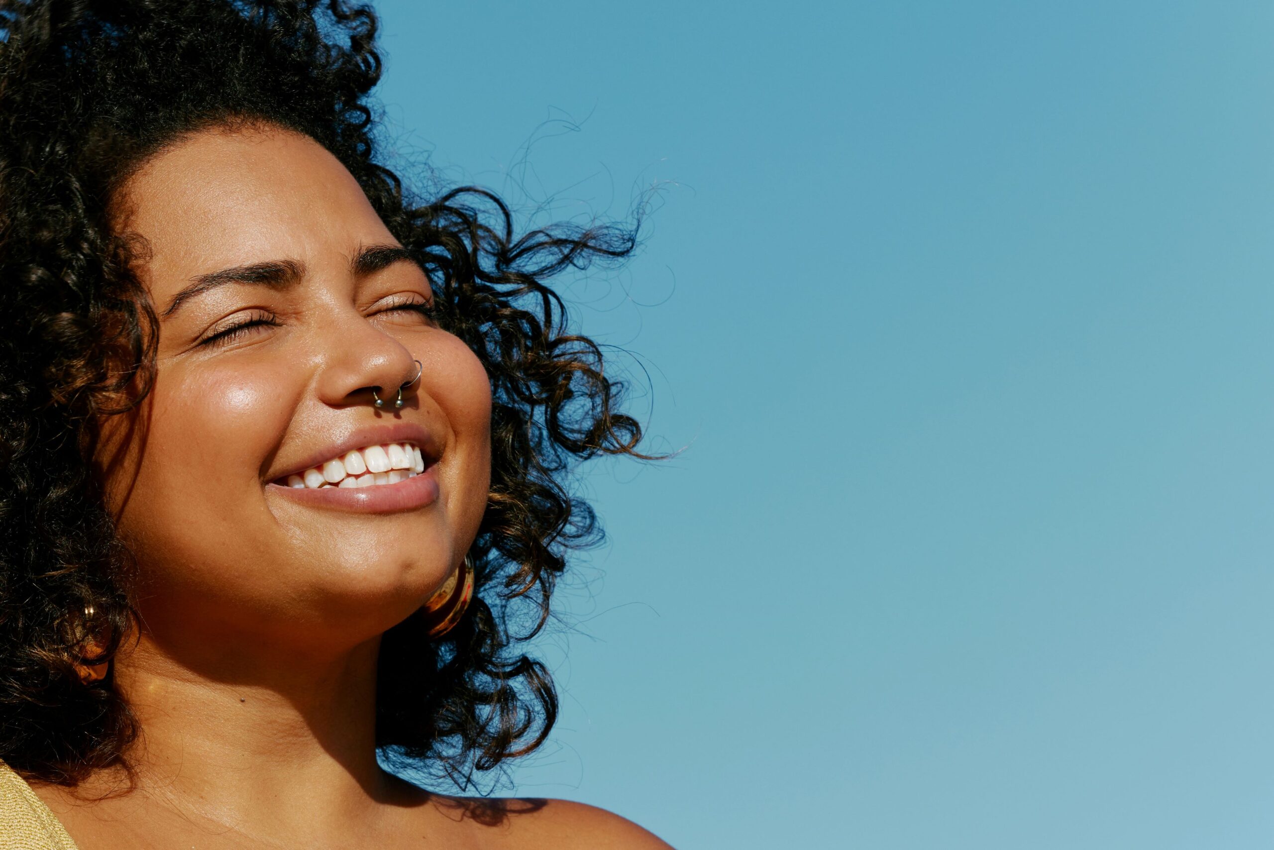 Woman smiling with a healthy mouth.