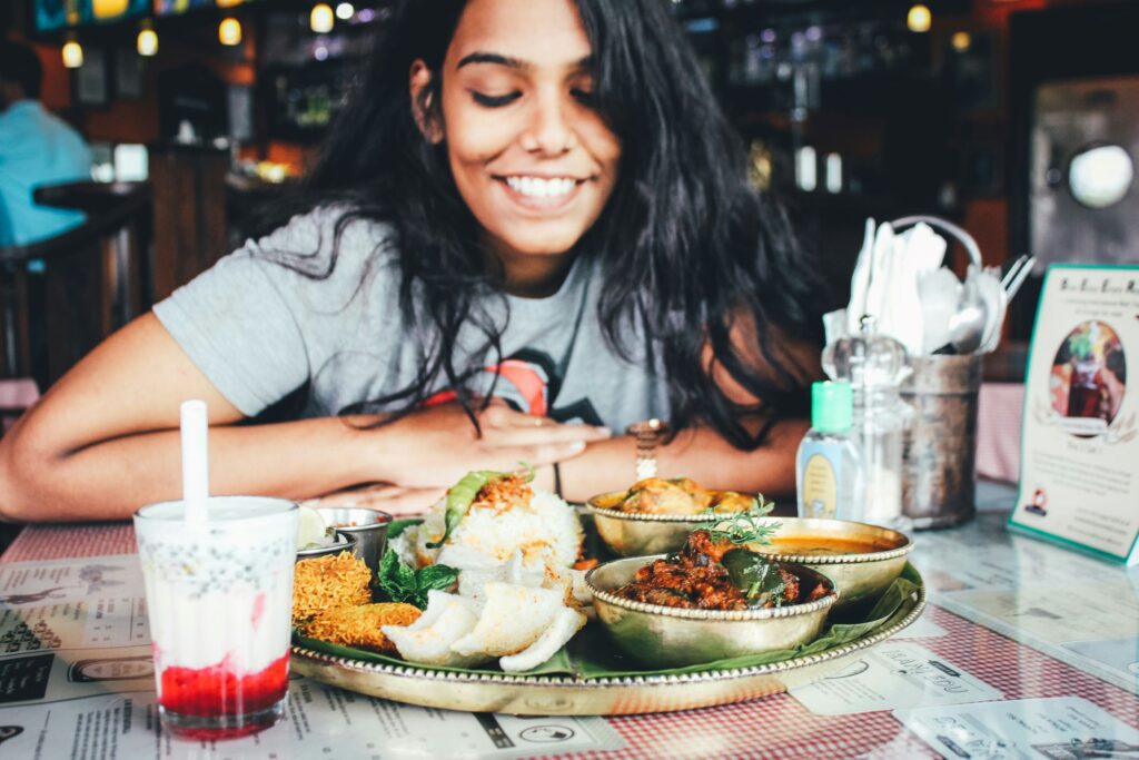 Person smiling at food.