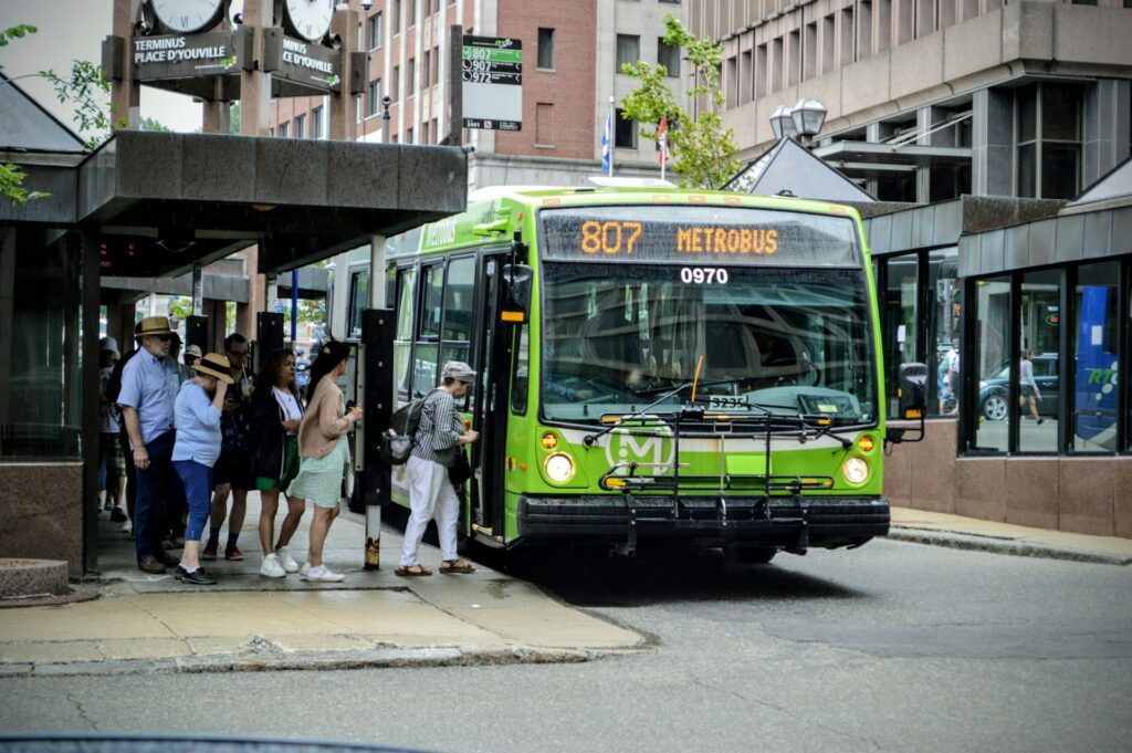 Group of people boarding a bus at the bus stop