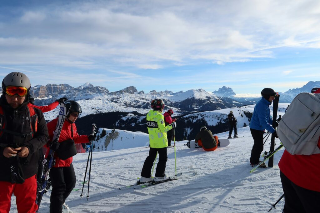 People with skis on a snow-covered slope