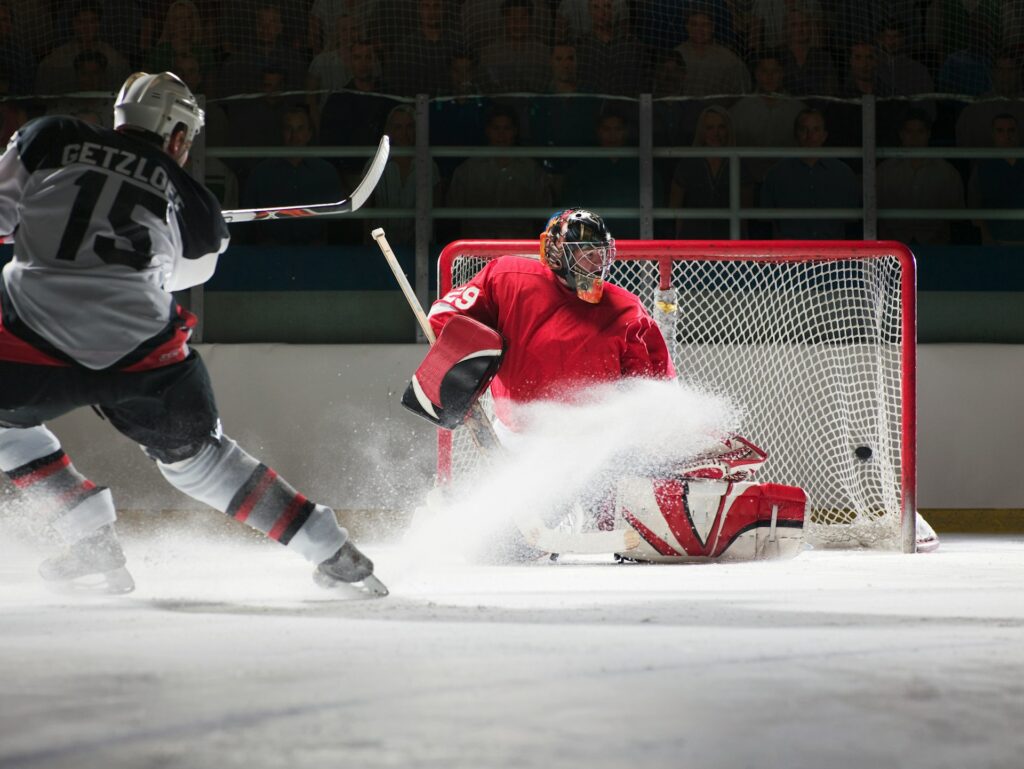 Two hockey players playing a game of ice hockey 