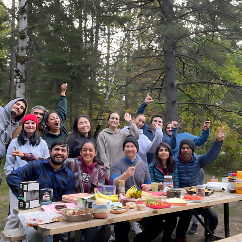 People celebrating together on a Northbound Tours camping trip.