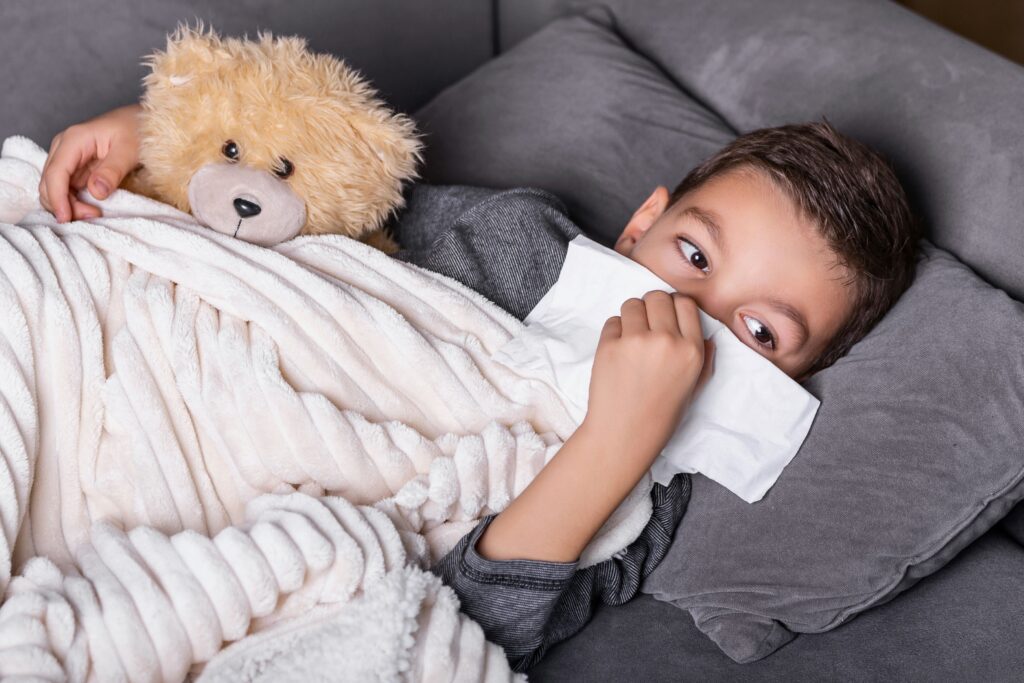 A child sick and in bed.