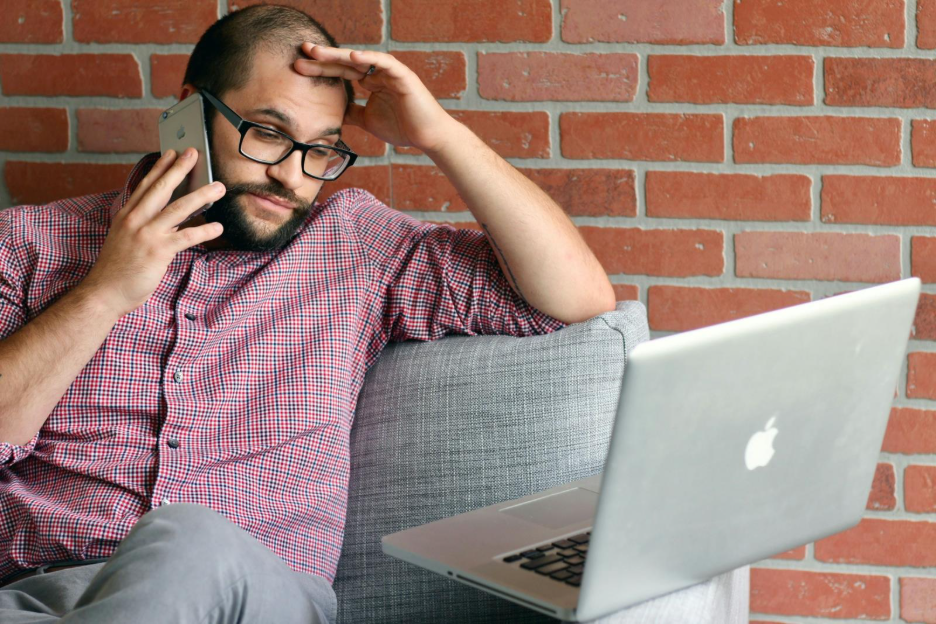 Image of person stressed when sending money.