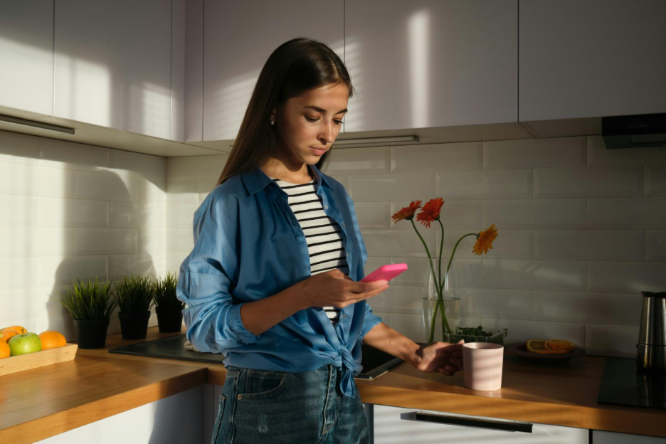 Image of person using Beacon app for sending money.