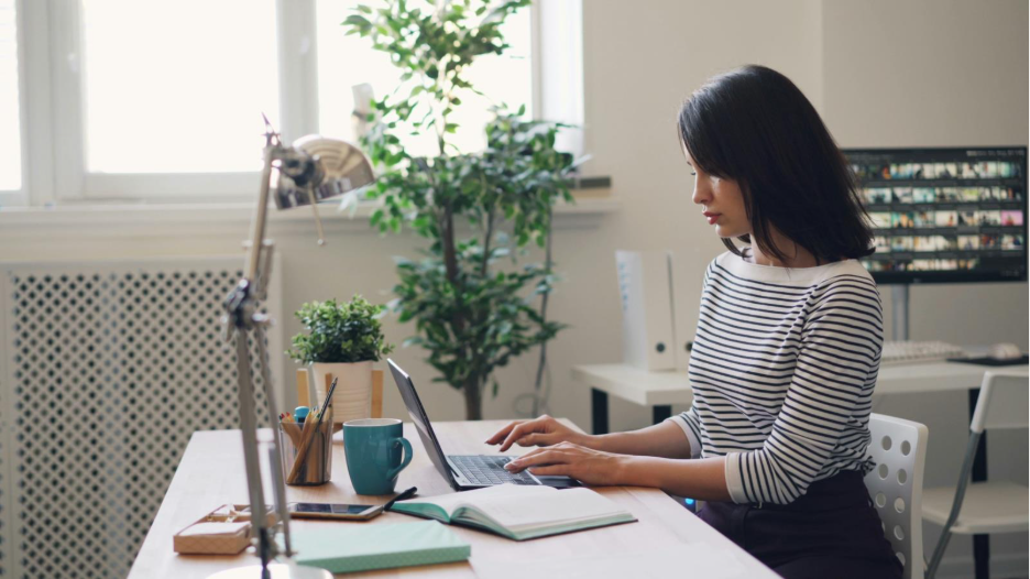 A person working on their budget with a financial advisor.